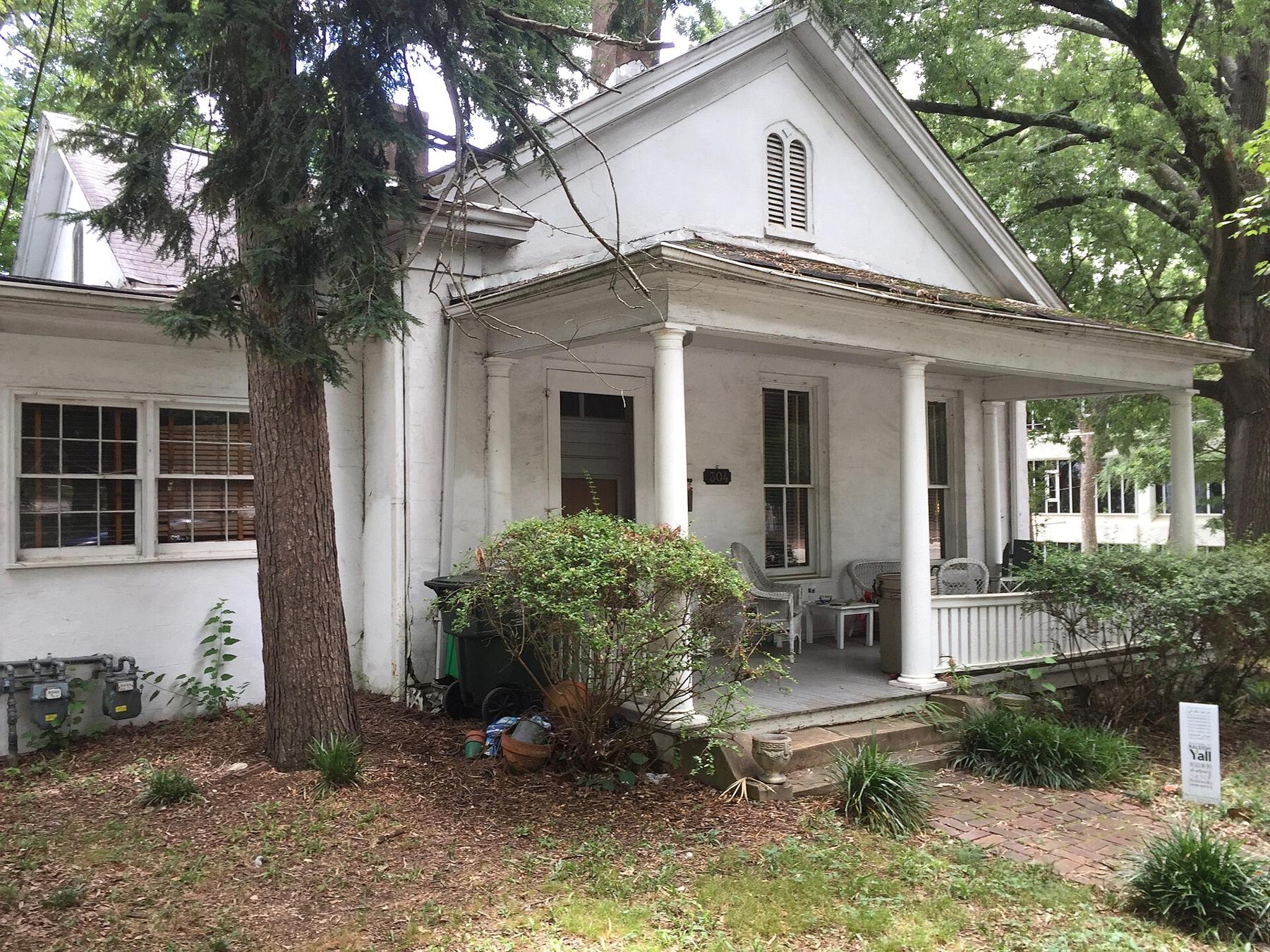 White cottage with a front porch